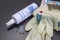 Hygiene spray and latex gloves - bottleneck, empty, used up