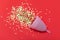 Hygienic menstrual cup cap in spray of puddle of shining stars on bright red background, symbol of blood. Studio shot flat lay,