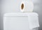 Hygienic paper on white toilet tank