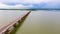 Hyper lapse 4k of aerial view across vehicles on Thep Sada Bridge 2-lane reinforced concrete bridge across Lam Pao Dam at Kalasin