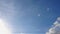 Hyper lapse of aircraft condensation contrails in the blue sky inbetween some beautiful clouds