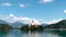 Hyper lapse of Bled Island with church of the Assumption of Mary and Bled castle on Lake Bled at clear summer day. Travel and adve