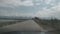 Hyper-lapse shot of the road while driving under the gloomy sky in a countryside