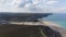 hyperlapse flying over Porthowan beach beautiful colors and sun rays clouds over ocean Devon