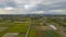 Hyperlapse: Side over rice fields and farms in fall harvest season