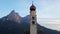 Hyperlapse video of church Saint Valentin and Shlern mountain in Italian village