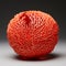 Hyperrealistic Sculpture: Intricate Orange Sphere With Red Roots