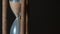 Hypnotic running vintage hourglass on a brown dark background. Close up shot