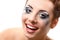 Hysterics crying and smiling woman with wet makeup over white