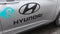Hyundai car logo brand and sign text on side door of vehicle electric parked in street