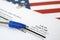 I-140 Immigrant petition for alien workers blank form lies on United States flag with blue pen from Department of Homeland