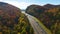 I-40 freeway in North Carolina leading to Asheville through Appalachian mountains in golden fall with fast moving trucks