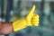 I approve of good hygiene. an unrecognizable mans gloved hand giving you a thumbs up.