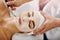 I can already feel it tingling. an attractive young woman getting a facial at a beauty spa.