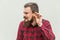 I can not hear you. Young adult bearded man listen