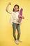 I can ride it. Kid girl happy holds penny board. Girl happy face carries penny board yellow background. Child learned