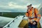 I cant believe Im getting cell reception up here. a young engineer inspecting a wind turbine.