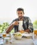 I cant start the day without a strong cuppa. Portrait of a handsome young man having breakfast at home.