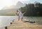 I could dance anywhere with you. a young couple dancing while spending time at a lake.