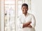 I couldnt be happier. Cropped portrait of a handsome young businessman standing with his arms crossed in the office.