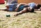 I didnt fall the floor just needed a hug. two young men lying on the grass after drinking too much at an outdoor