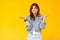 I don`t know. Portrait of confused beautiful brunette young woman with makeup in denim casual style standing with raised arms,