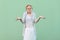 I don`t know. Portrait of confused doubtful young blonde woman in white striped blouse with eyeglasses standing raised arms and