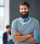 I really enjoy working with these guys. Portrait of a handsome young businessman standing with his arms folded with his