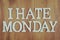 I Hate Monday alphabet letters top view on wooden background