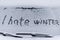 I hate winter phrase on the car window. Winter negative, concept.