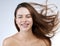 I hope youre having a good hair day too. Studio shot of a beautiful young woman posing against a white background.