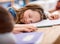 I just need to rest my brain for a bit. an elementary school girl sleeping on her desk in class.