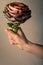 I\'ll give you an artichoke flower. Vegetarian, vegan concept. Hand