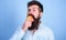 I love apples Man handsome hipster with long beard eating apple. Hipster hungry bites juicy ripe apple. Fruit healthy