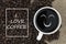 I love coffee text in coffee cup on coffee beans background