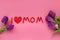 I love mum inscription from plasticine and tulip flower. Happy mothers day