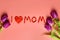 I love mum inscription from plasticine and tulip flower. Happy mothers day