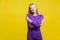 I love myself. Portrait of satisfied selfish woman embracing herself. indoor studio shot isolated on yellow background