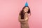 I love myself! Portrait of selfish beautiful young woman with long brunette hair wearing party cone standing