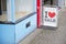 I love sale sign board on street pavement outside shop with love heart