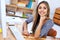 I love working here. A portrait of a beautiful young professional working at her desk.