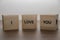 I love you. Good life, feel, love. Positive inspirational messages and words on wooden cubes