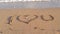 I love You sign on the sandy beach.