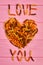 I love you text made of fusilli pasta.