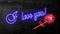 I love you. Text and red rose in neon glow appearing on a dark background