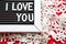 I love you in white letters on a framed blackboard. Whiteboard for entries and tags. Valentine`s Day, a declaration of love, a