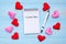 I LOVE YOU word on note book and pen with red and pink heart shape decoration on blue wooden table background. Love, Wedding,