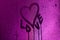 I love you written on condensation glass with purple light