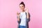 I`m okay! Portrait of positive brunette teenage girl showing ok symbol, agree approve gesture. studio shot, pink background