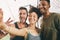 I met my best friends at the gym. three sporty young people taking a selfie at the gym.